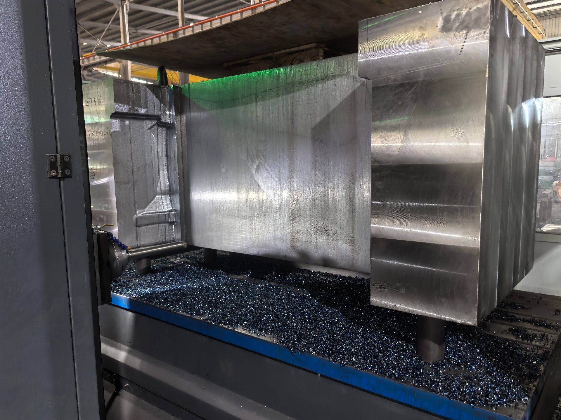 CNC machining center milling a large mold block