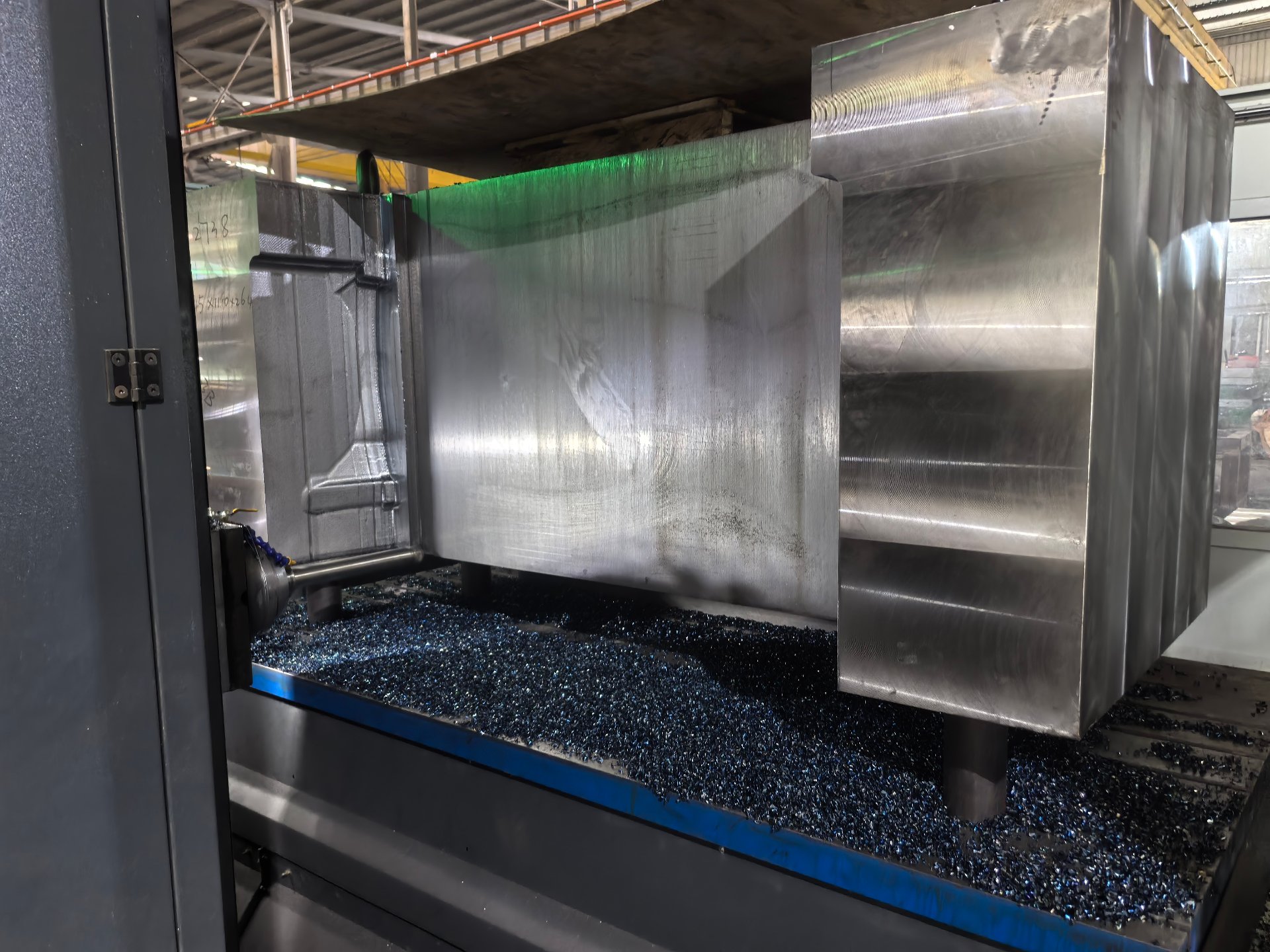 CNC machining center milling a large mold block
